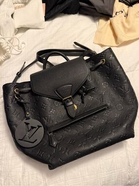 Louis Vuitton Montsouris PM Backpack- Black Monogram Empreinte Leather.